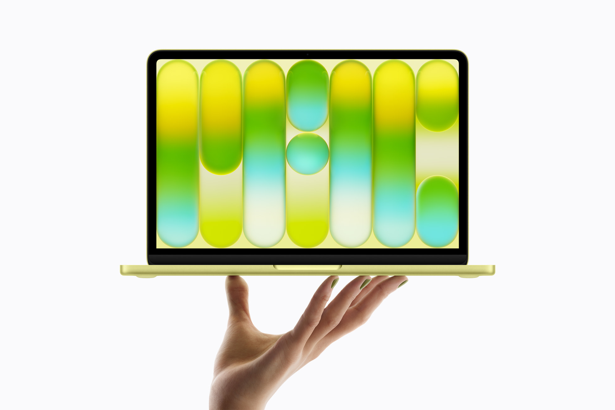 손 위에 펼쳐진 시트러스 색상 MacBook Neo 전체 모습